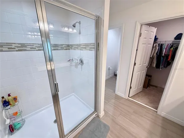 a white toilet sitting next to a bathroom sink