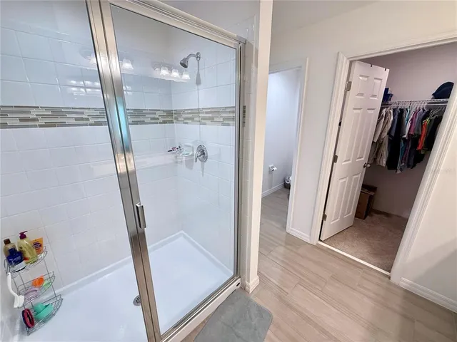 a white toilet sitting next to a bathroom sink