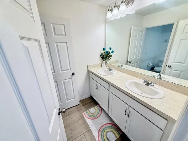 a white toilet sitting next to a shower curtain
