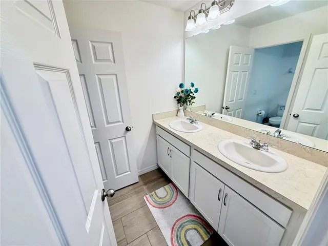 a white toilet sitting next to a shower curtain