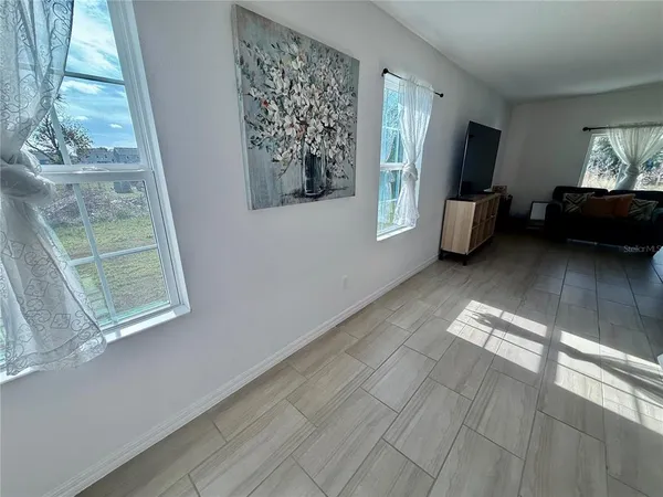 a view of livingroom with furniture and windows