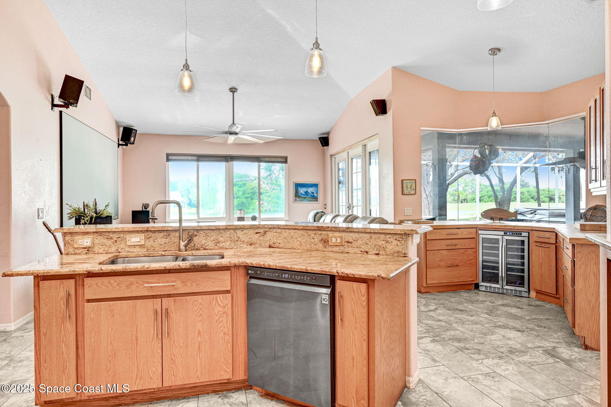 4073 Sand Ridge Drive Merritt Island, FL 32953 - Photo 11 of 66 a kitchen with kitchen island granite countertop a sink and a stove