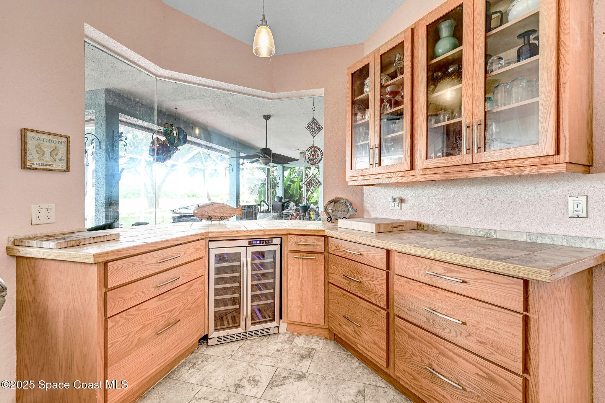 4073 Sand Ridge Drive Merritt Island, FL 32953 - Photo 15 of 66 a kitchen with granite countertop cabinets and window