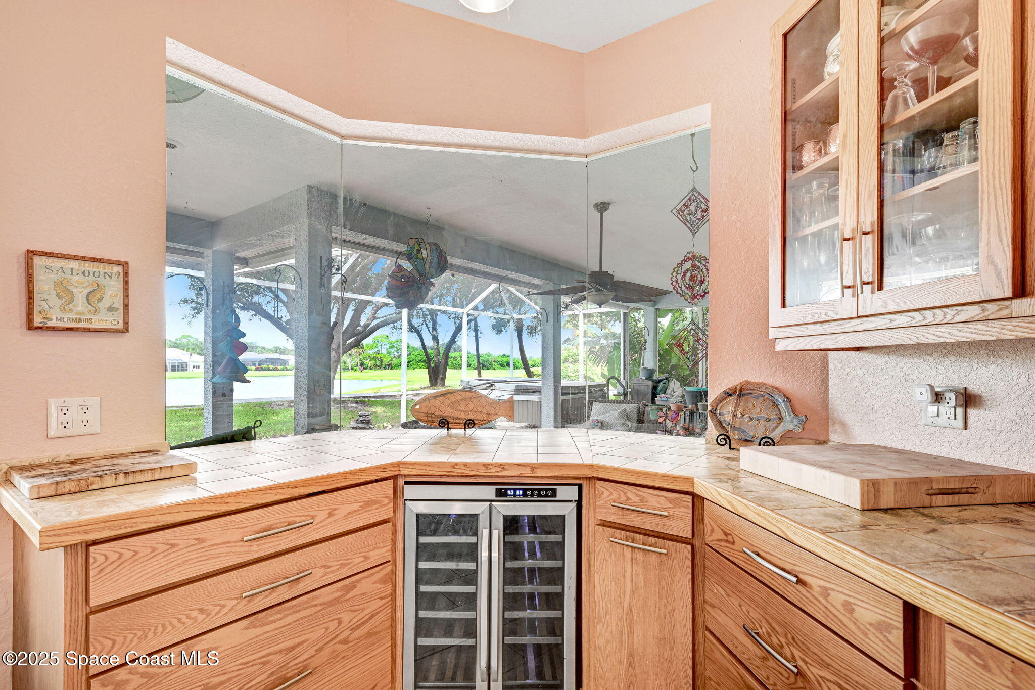 4073 Sand Ridge Drive Merritt Island, FL 32953 - Photo 16 of 66 a kitchen with a sink and a large window