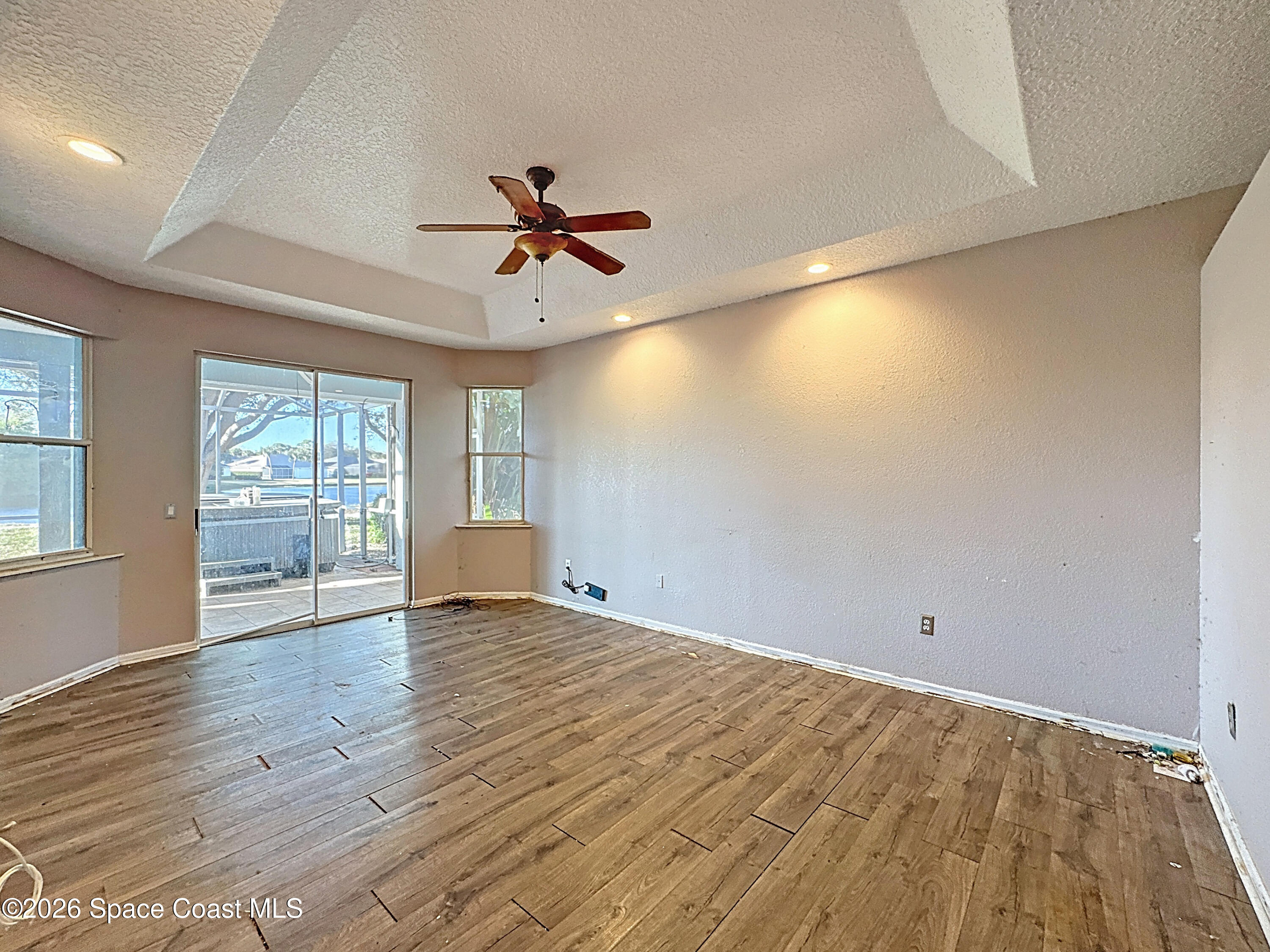 4073 Sand Ridge Drive Merritt Island, FL 32953 - Photo 23 of 66 a view of empty room with wooden floor and fan