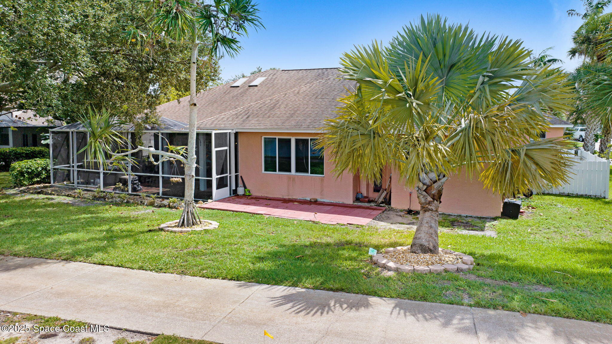 4073 Sand Ridge Drive Merritt Island, FL 32953 - Photo 38 of 66 a front view of a house with garden
