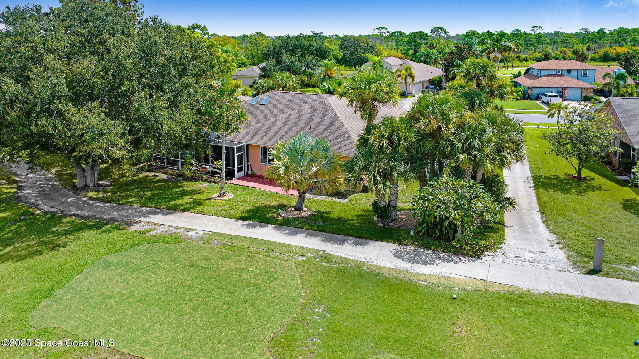 4073 Sand Ridge Drive Merritt Island, FL 32953 - Photo 39 of 66 an aerial view of residential houses with outdoor space and trees