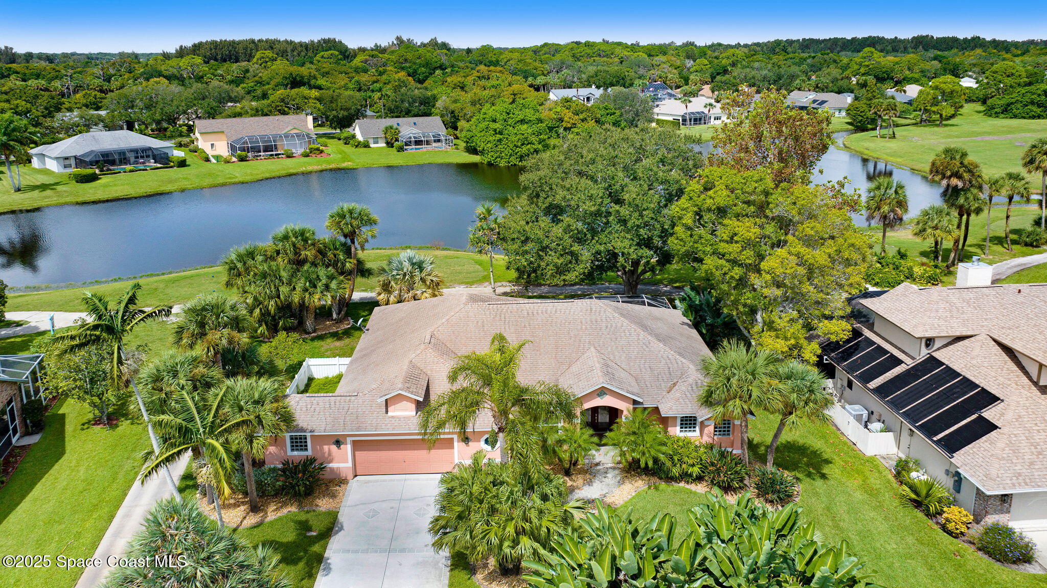 4073 Sand Ridge Drive Merritt Island, FL 32953 - Photo 53 of 66 an aerial view of residential houses with outdoor space and lake view