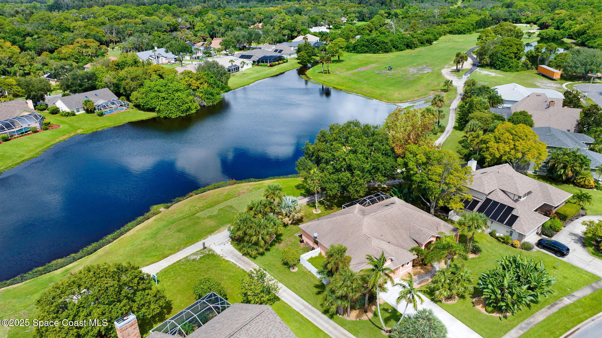 4073 Sand Ridge Drive Merritt Island, FL 32953 - Photo 57 of 66 an aerial view of a house with a yard and garden