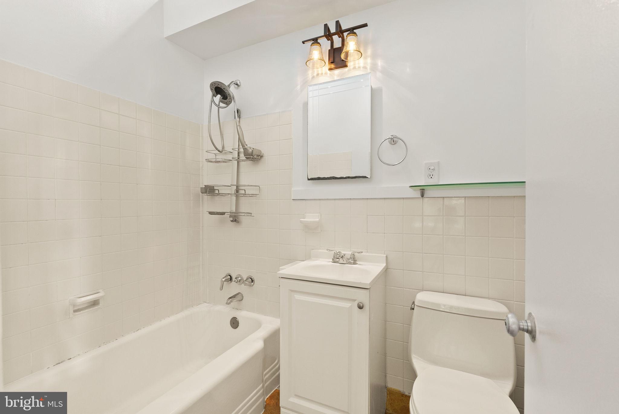 2602 Harris Avenue Silver Spring, MD 20902 - Photo 15 of 25 a bathroom with a bathtub sink and toilet
