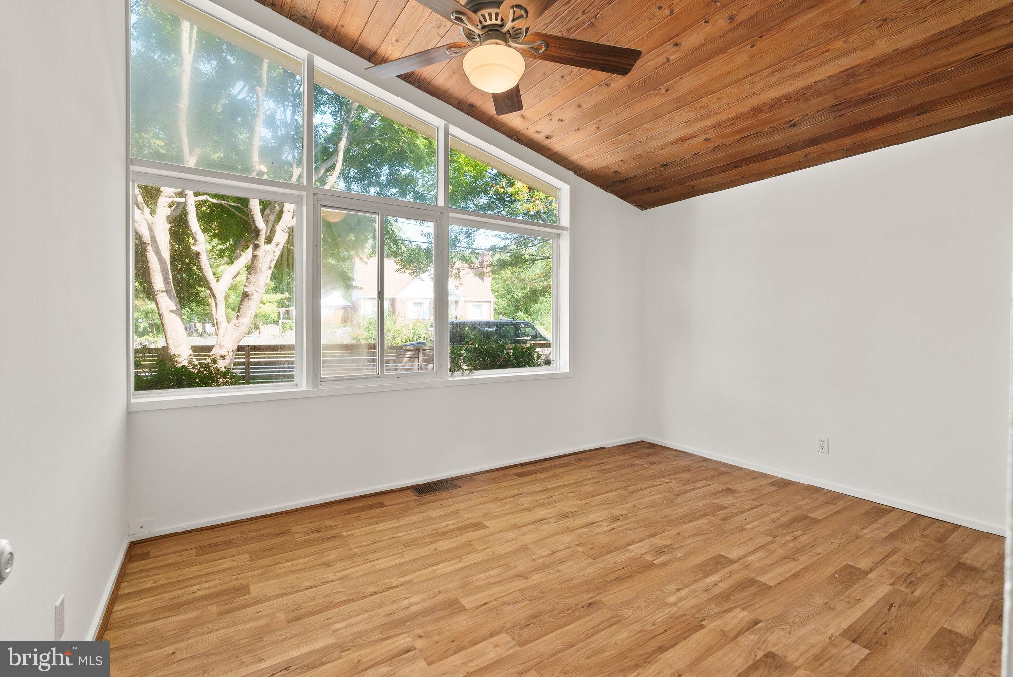 2602 Harris Avenue Silver Spring, MD 20902 - Photo 16 of 25 a view of empty room with wooden floor and fan