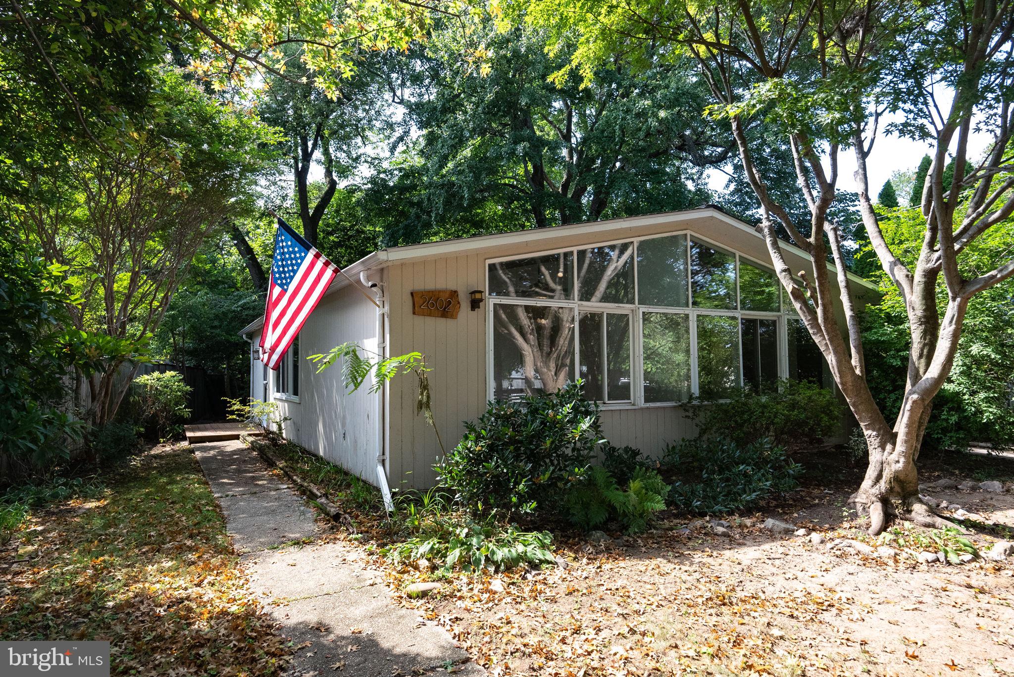 2602 Harris Avenue Silver Spring, MD 20902 - Photo 2 of 25 a view of a small house in middle of the forest