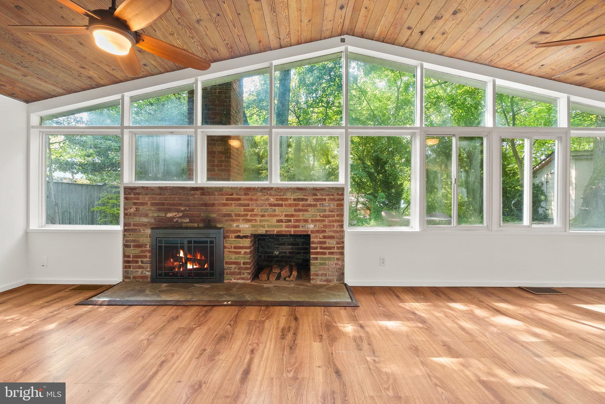 2602 Harris Avenue Silver Spring, MD 20902 - Photo 5 of 25 a view of empty room with wooden floor and a fireplace