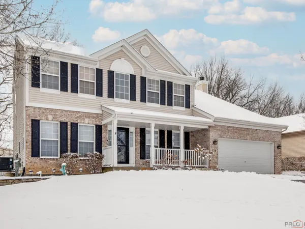 front view of a house with a yard