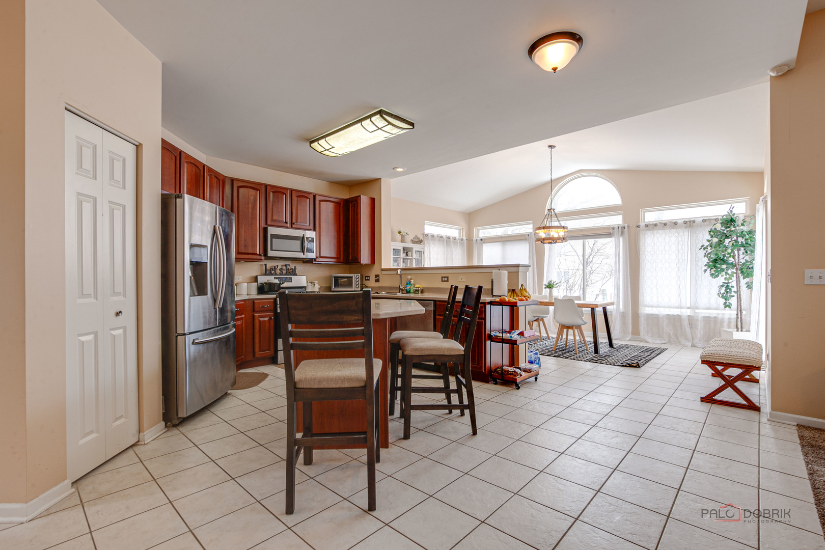 578 North Overlook Trail Round Lake, IL 60073 - Photo 13 of 42 a kitchen with stainless steel appliances a refrigerator and a dining table