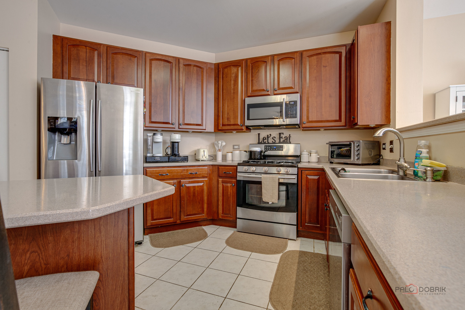 578 North Overlook Trail Round Lake, IL 60073 - Photo 16 of 42 a kitchen with stainless steel appliances granite countertop a refrigerator stove top oven a sink and dishwasher