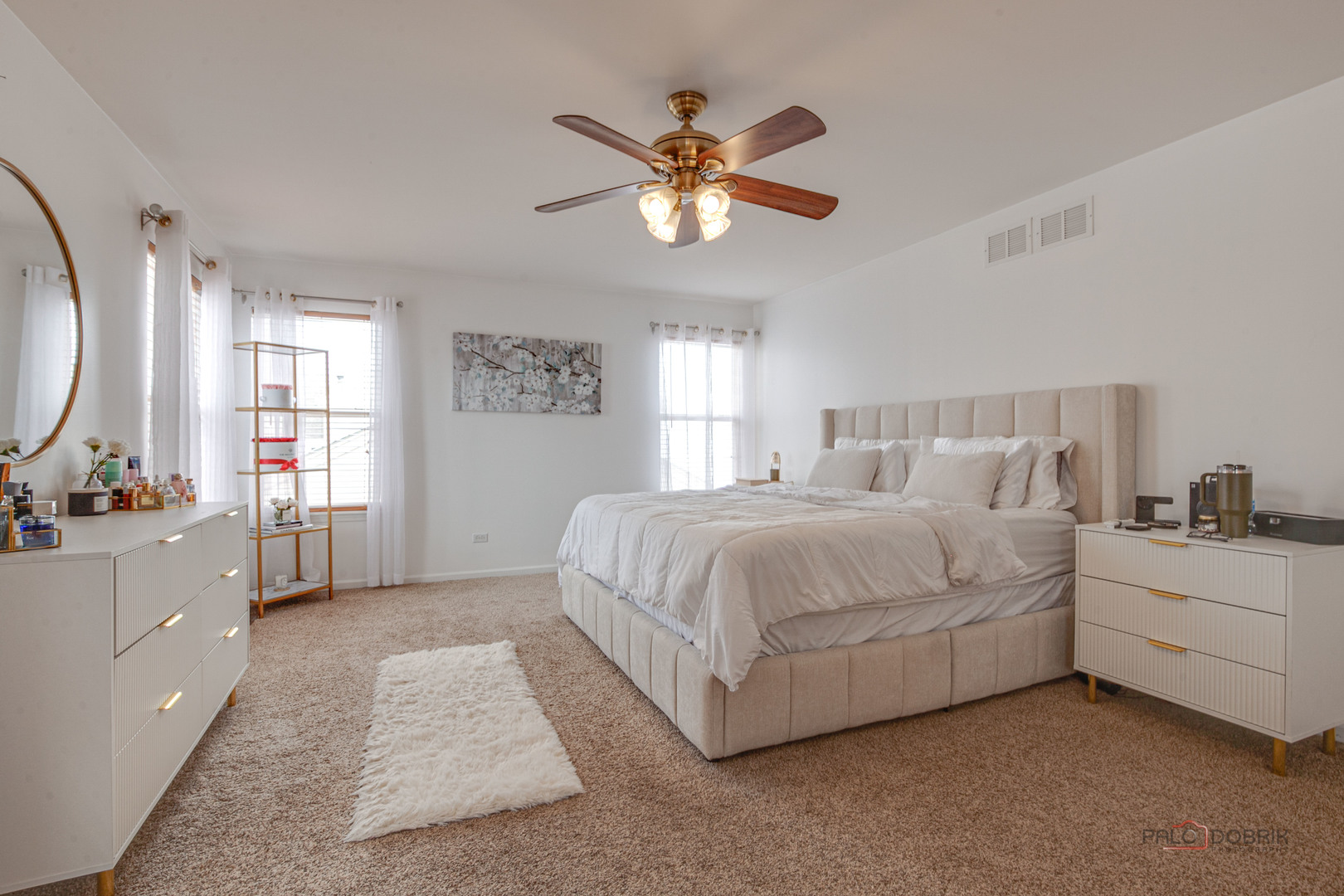 578 North Overlook Trail Round Lake, IL 60073 - Photo 22 of 42 a spacious bedroom with a large bed and a chandelier