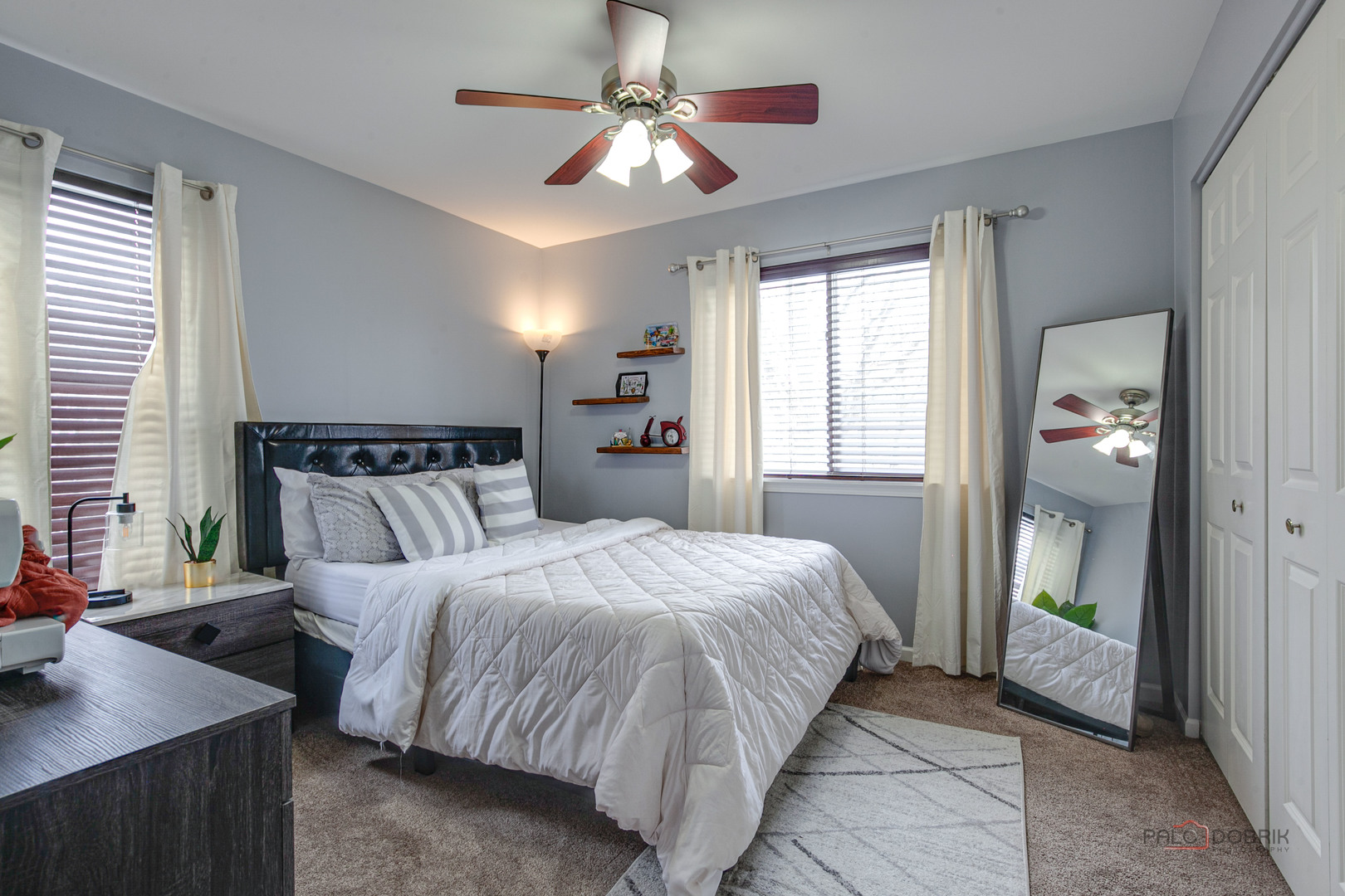 578 North Overlook Trail Round Lake, IL 60073 - Photo 31 of 42 a bedroom with a bed and a chandelier
