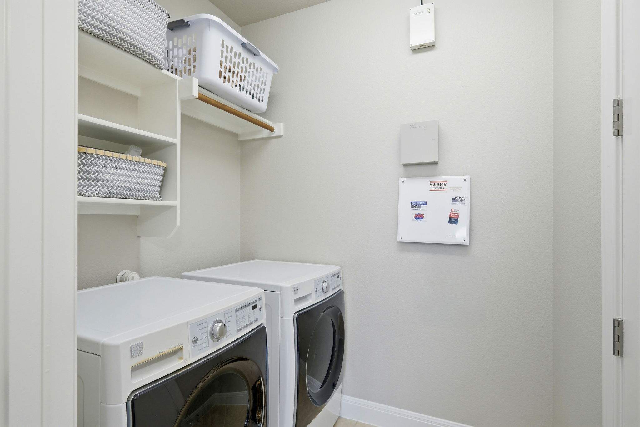 110 Dasher Drive Cedar Park, TX 78613 - Photo 29 of 39 A well-organized laundry area featuring convenient shelving and essential appliances.
