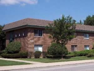 444 Spring Road, Unit 16 Elmhurst, IL 60126 - Photo 1 of 1 a front view of a house with a yard
