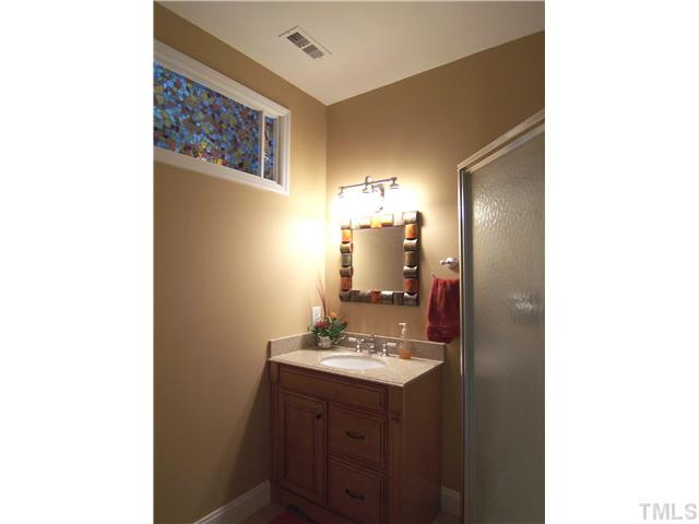 908 Rockfall Court Raleigh, NC 27614 - Photo 19 of 25 There is a full Bath w/tile floor, corner shower 7 granite-topped vanity off the Bonus Rm. Bathroom