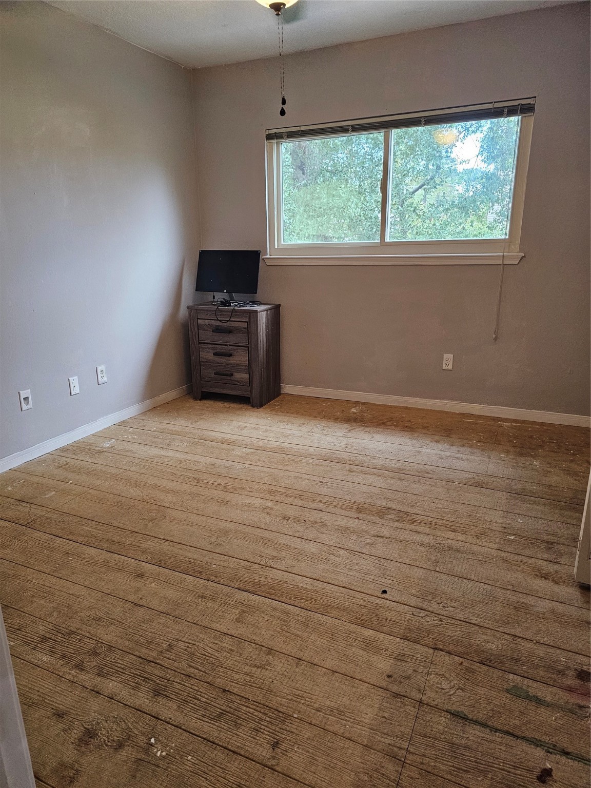 3710 Blue Lake Drive Spring, TX 77388 - Photo 13 of 15 a view of a room with wooden floor and a window