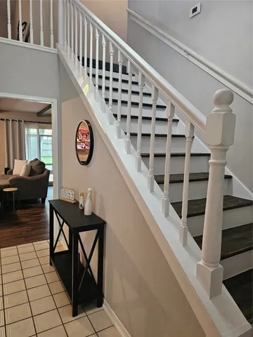 a view of entryway with workspace and stairs