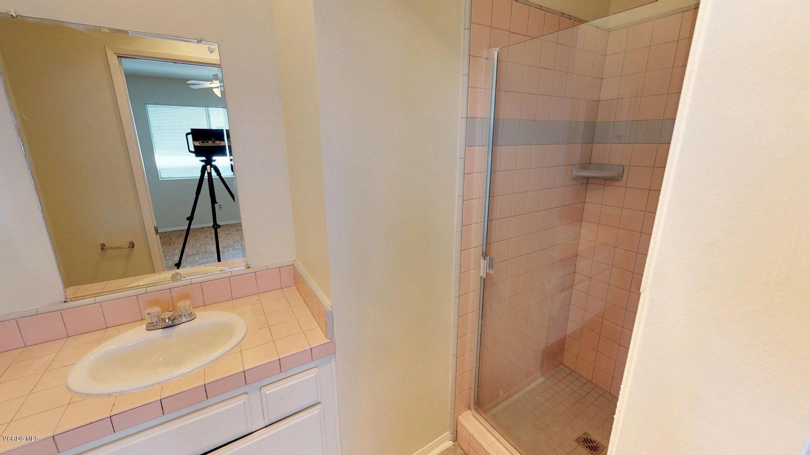 536 Spring Road, Unit 97 Moorpark, CA 93021 - Photo 22 of 27 a bathroom with a sink and a mirror