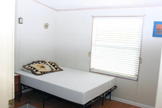 a white bath tub sitting next to a window