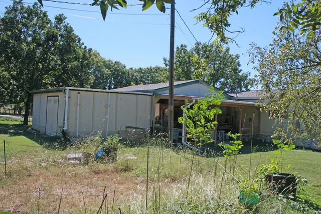 a view of a garden in front of a house