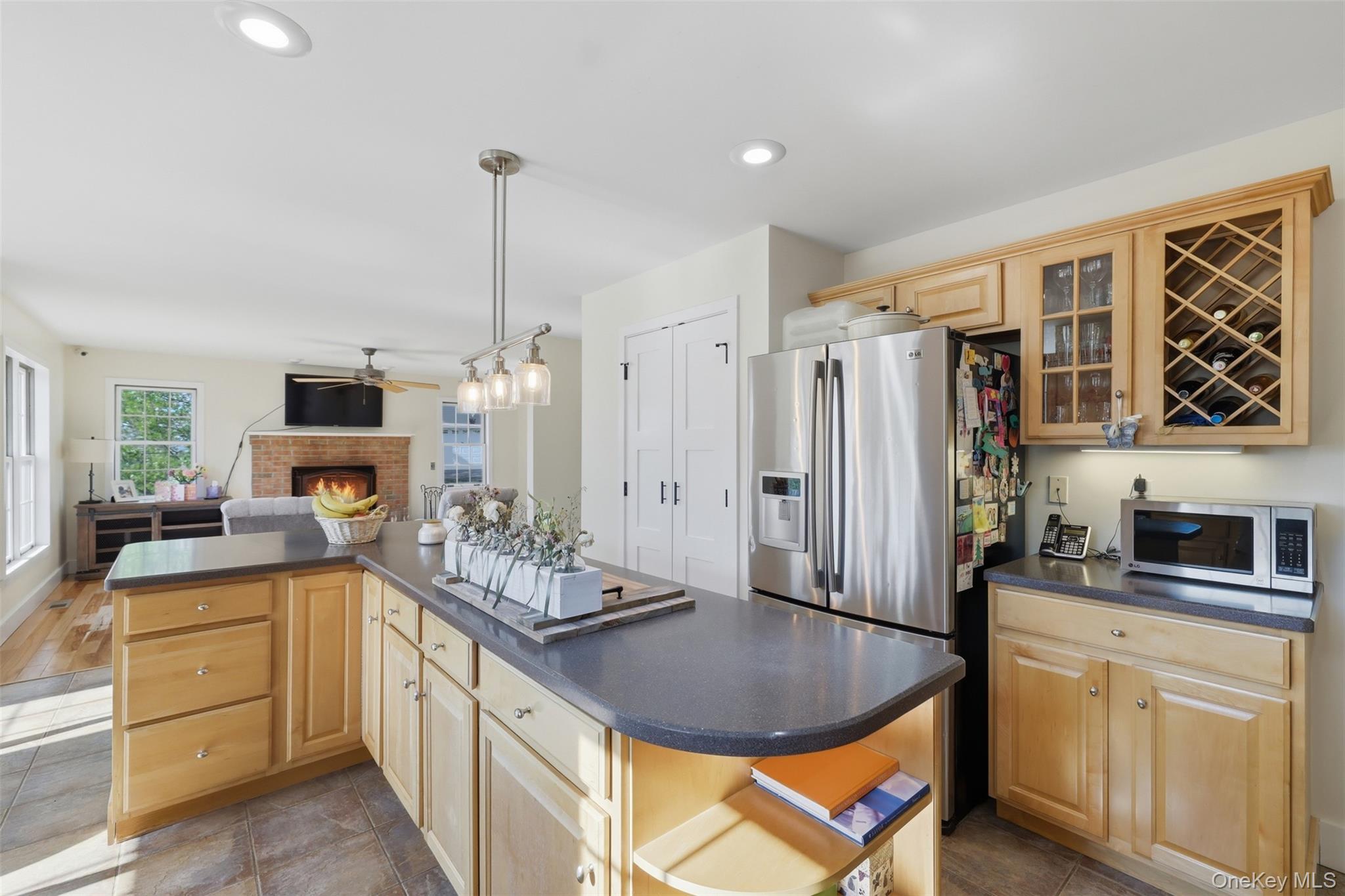 233 Devon Farms Road Stormville, NY 12582 - Photo 17 of 48 a kitchen with stainless steel appliances granite countertop a sink and cabinets