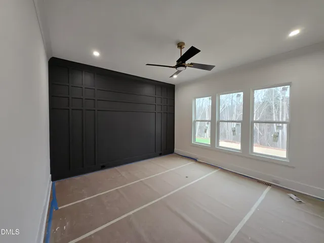 a bathroom with a sink vanity granite and a mirror