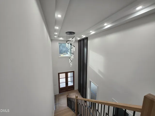 a view of a hallway with a kitchen