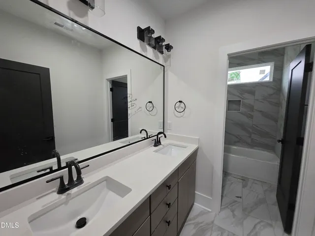 a bathroom with a toilet and a bathtub