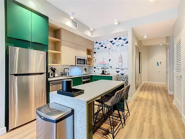 a bathroom with a bathtub sink and mirror