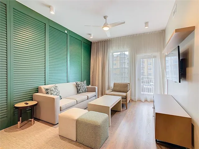 a bathroom with a bathtub and next to a window