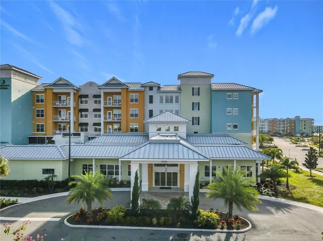 a kitchen with stainless steel appliances kitchen island granite countertop a sink and cabinets