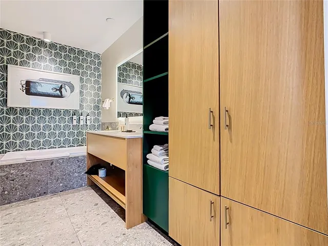 a view of a lake with tall buildings