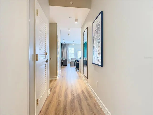 a kitchen with kitchen island a sink stainless steel appliances and cabinets