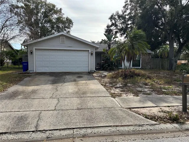 a view of a backyard of the house