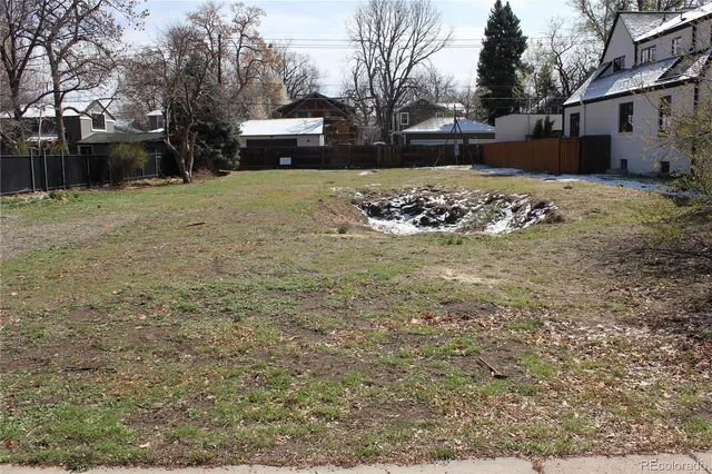 a view of a backyard of the house