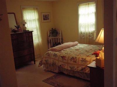 1685 Bridge Road Eastham, MA 02642 - Photo 13 of 22 a bedroom with a bed and a window