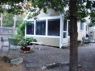1685 Bridge Road Eastham, MA 02642 - Photo 17 of 22 a view of a house with backyard and sitting area
