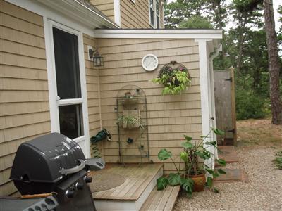 1685 Bridge Road Eastham, MA 02642 - Photo 3 of 22 a backyard of a house with seating space