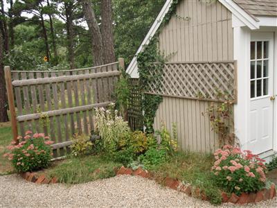 1685 Bridge Road Eastham, MA 02642 - Photo 5 of 22 a balcony with trees in front of it