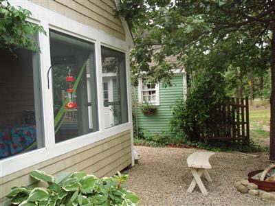 1685 Bridge Road Eastham, MA 02642 - Photo 6 of 22 a view of a bench in the yard