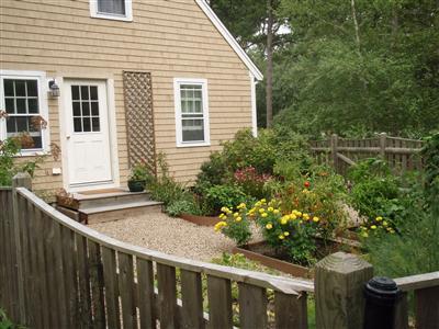 1685 Bridge Road Eastham, MA 02642 - Photo 8 of 22 a view of a house with a yard
