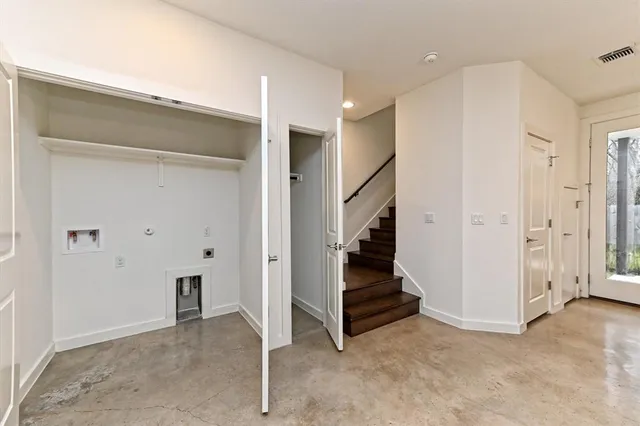 a view of entryway with stairs and white walls