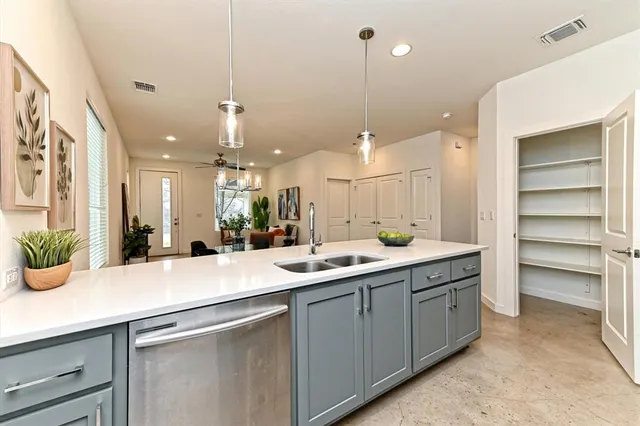 a kitchen with kitchen island white cabinets and center island