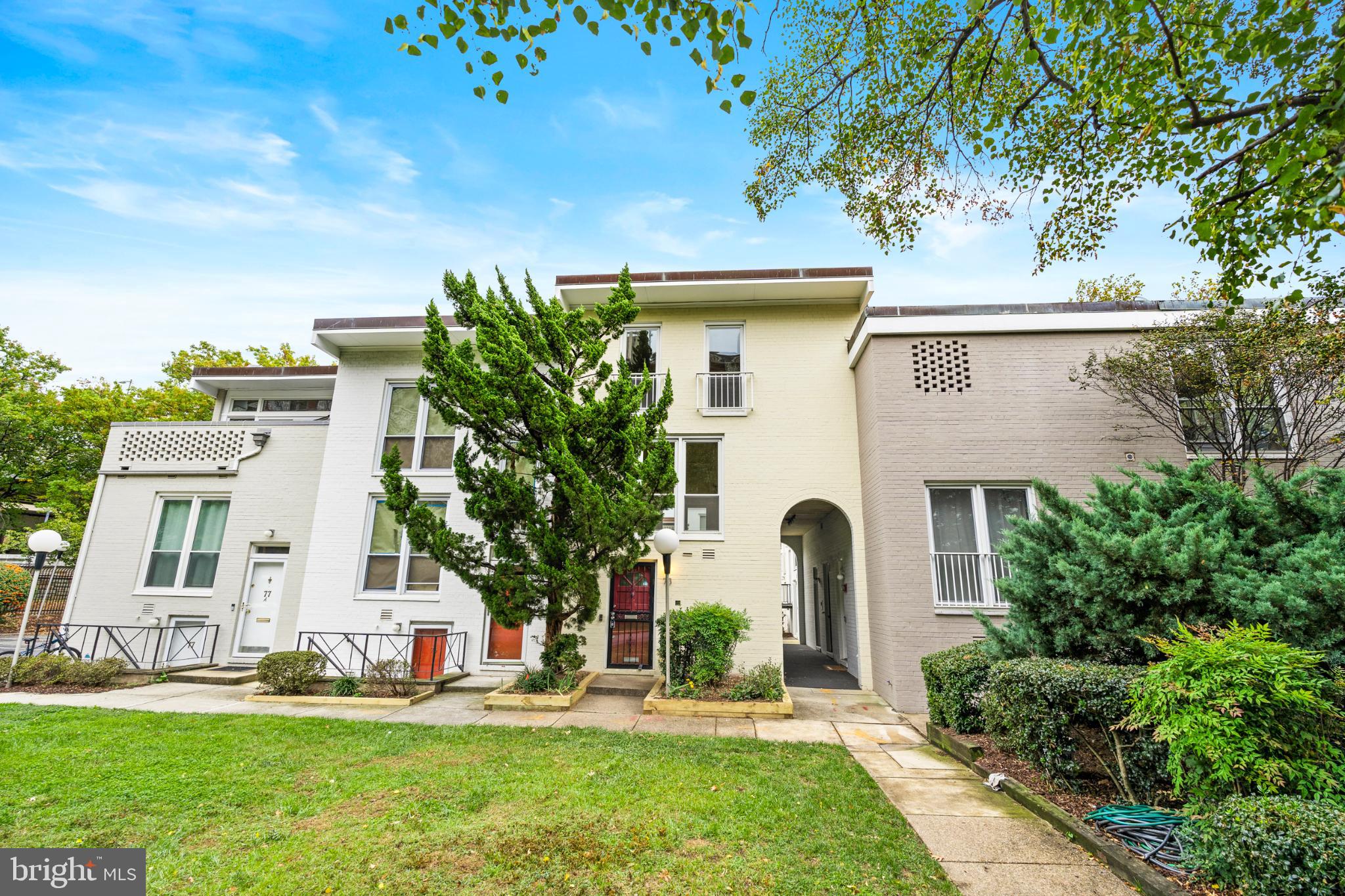 a front view of a house with garden